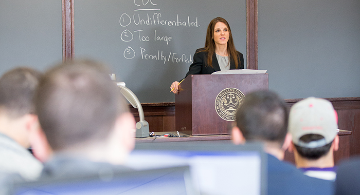 A professor teaching in a classroom