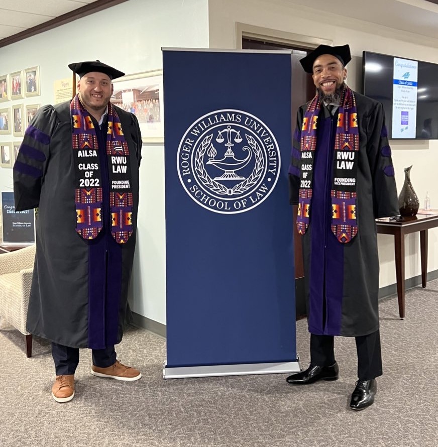 Graduation image of RWU Law alum Taino Palermo and Raymond Two Hawks Watson