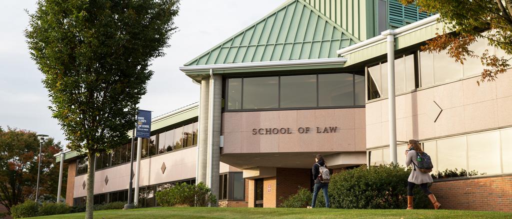 Students walking toward the front of the building. 