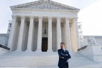Saad Ahmad L'00 RWU Law alumni in front of the US Supreme Court