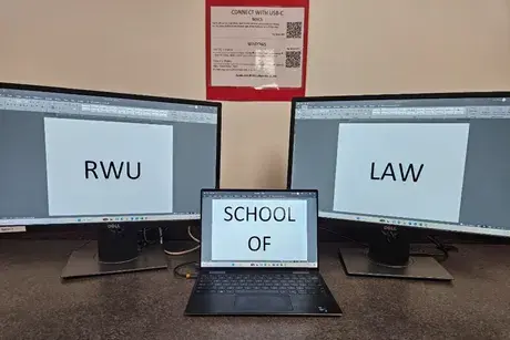 Laptop connected to a docking station with two monitors