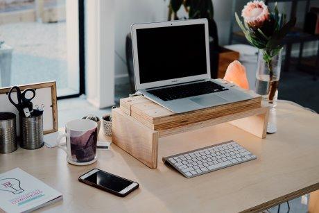 Standing desk with laptop on it.