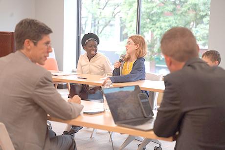 Justice Camp attendees engage in a debate with investigative journalist Tim White and Providence Mayor Brett Smiley.