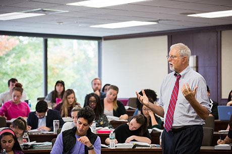 Professor Logan lecturing in classroom