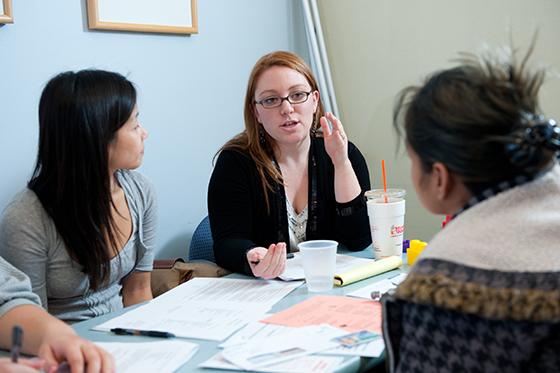 Students collaborate around a table