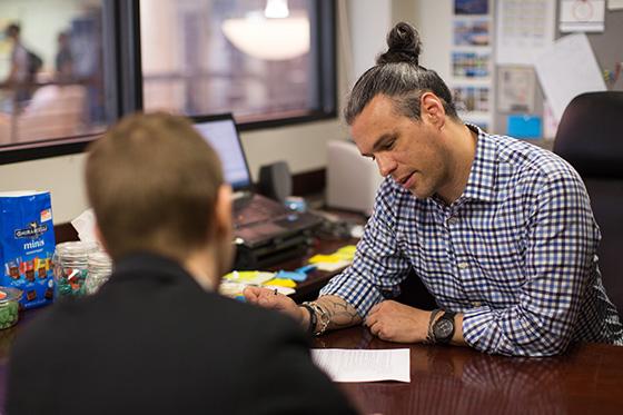 Professor helps edit student assignment 