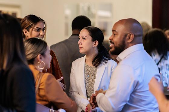 Students mingle at a law event