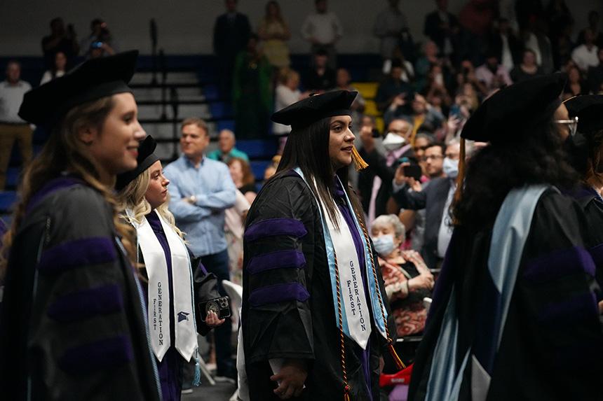 Graduates watch ceremony