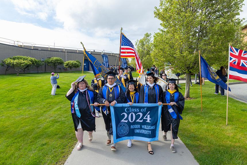 Class officers carry Class of 2024 banner