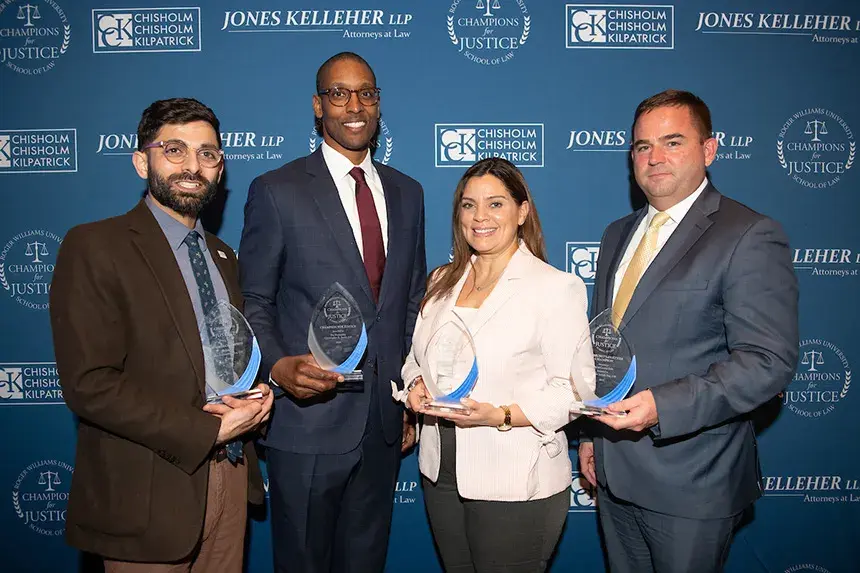 Champions for Justice honorees posing with their awards