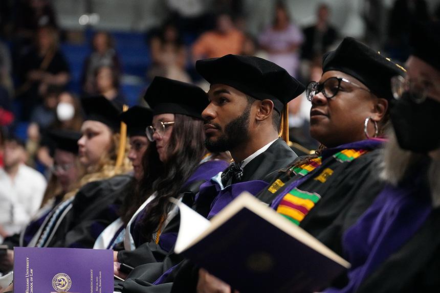 Graduates watch ceremony